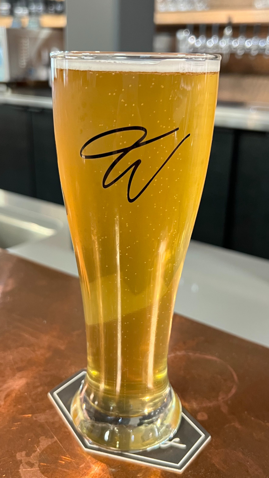 A glass of beer from Woody's Taphouse
